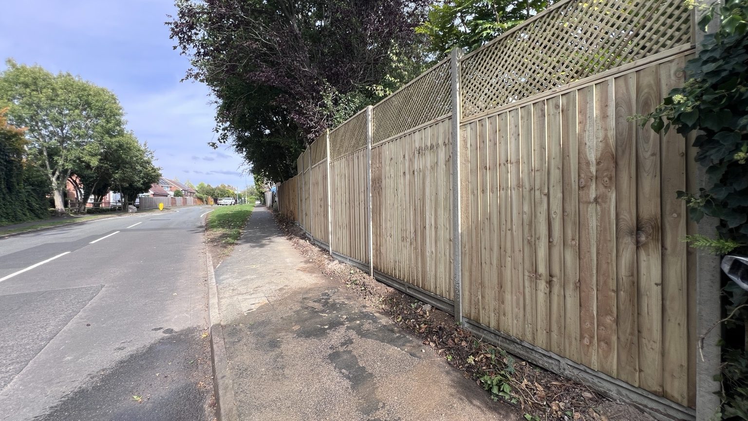 Long run of timber fencing